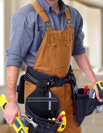 Builder handyman in home. House renovation background.